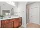 This bathroom features modern design, a glass shower, and cherry cabinets at 2241 Chaseford Ln, Powder Springs, GA 30127