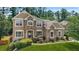 Beautiful brick home with manicured lawn and mature landscaping, offering great curb appeal at 2241 Chaseford Ln, Powder Springs, GA 30127