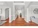 Inviting foyer with gleaming hardwood floors, neutral paint, and arched doorways for an elegant entrance at 2241 Chaseford Ln, Powder Springs, GA 30127