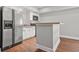 A kitchen featuring stainless steel appliances, white cabinets, and a breakfast bar at 2241 Chaseford Ln, Powder Springs, GA 30127