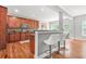 Bright kitchen featuring an island with seating, stainless appliances, and ample natural light at 2241 Chaseford Ln, Powder Springs, GA 30127