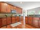 Spacious kitchen with granite countertops, stainless steel microwave, and hardwood floors at 2241 Chaseford Ln, Powder Springs, GA 30127