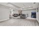 A spacious living room featuring a grey sectional sofa at 2241 Chaseford Ln, Powder Springs, GA 30127