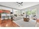 Bright open-concept living room with hardwood floors and seamlessly connected to kitchen area at 2241 Chaseford Ln, Powder Springs, GA 30127