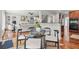 Open-concept living area with a kitchen, hardwood floors, and stylish decor at 2241 Chaseford Ln, Powder Springs, GA 30127