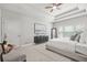 This bedroom features a trey ceiling, modern furniture, and neutral tones at 2241 Chaseford Ln, Powder Springs, GA 30127