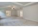 Large bedroom features a vaulted ceiling, ceiling fan, and access to a bath at 428 Hatcher Ct, Hampton, GA 30228