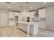 Spacious kitchen with stainless appliances, large island, and ample storage space at 428 Hatcher Ct, Hampton, GA 30228