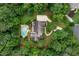Breathtaking aerial perspective of estate home with a private pool, long driveway, and beautiful landscaping at 140 Silvermere, Fayetteville, GA 30215