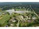 Aerial view of a golf course community with a lake and beautiful homes on large lots at 140 Silvermere, Fayetteville, GA 30215