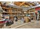 Unfinished basement space with exposed ductwork and wooden shelves for ample storage at 140 Silvermere, Fayetteville, GA 30215