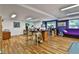 Finished basement offering ample space for various activities with wood floors and recessed lighting at 140 Silvermere, Fayetteville, GA 30215