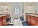 Bright bathroom boasts double vanity, soaking tub with decorative window, and walk-in shower at 140 Silvermere, Fayetteville, GA 30215
