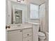 Cozy bathroom with a vanity, toilet, and shower and tub with shower curtain at 140 Silvermere, Fayetteville, GA 30215