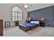 Charming bedroom with lots of natural light from the large arched window at 140 Silvermere, Fayetteville, GA 30215