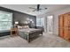 Inviting bedroom features an en-suite bathroom, ceiling fan, and closet at 140 Silvermere, Fayetteville, GA 30215