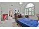 Bright bedroom with vaulted ceiling, fan, and large arched window dressed with window shutters at 140 Silvermere, Fayetteville, GA 30215
