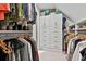 Organized walk-in closet with custom shelves, hanging bars, and drawer units at 140 Silvermere, Fayetteville, GA 30215