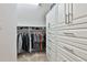 Spacious closet provides ample storage, with custom built-ins and hanging racks at 140 Silvermere, Fayetteville, GA 30215