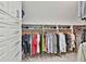 Walk-in closet features custom shelving, hanging space, and storage drawers at 140 Silvermere, Fayetteville, GA 30215