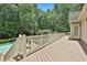 Large backyard deck with views of the swimming pool and lush, green landscape at 140 Silvermere, Fayetteville, GA 30215