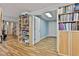 A bright flex room with hardwood flooring, custom cabinets, and shelving units at 140 Silvermere, Fayetteville, GA 30215