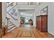 Grand foyer featuring gleaming hardwood floors, a staircase, and an open view to the bright living spaces at 140 Silvermere, Fayetteville, GA 30215