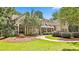 Attractive exterior showcasing a well-manicured lawn, a charming porch, and beautiful curb appeal at 140 Silvermere, Fayetteville, GA 30215