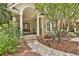 Inviting front porch with classic columns and a beautiful entrance to this charming home at 140 Silvermere, Fayetteville, GA 30215