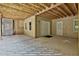 Spacious garage showcasing a covered area with exposed wood beams, leading to the home's entrance at 140 Silvermere, Fayetteville, GA 30215