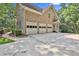 Spacious three-car garage showcasing ample parking and a well-maintained exterior at 140 Silvermere, Fayetteville, GA 30215