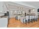 Bright kitchen with white cabinets, granite countertops, and a stainless steel refrigerator at 140 Silvermere, Fayetteville, GA 30215