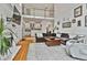 Open living room showcasing a fireplace, hardwood floors, and view to the kitchen and second floor at 140 Silvermere, Fayetteville, GA 30215