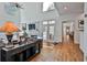 Bright living room with high ceilings, hardwood floors, fireplace, and French doors at 140 Silvermere, Fayetteville, GA 30215