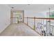 Bright and airy loft space with wood railing overlooking the living area below at 140 Silvermere, Fayetteville, GA 30215