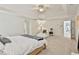 Generous main bedroom with a tray ceiling, cozy sitting area, and ample natural light at 140 Silvermere, Fayetteville, GA 30215