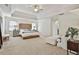 Expansive main bedroom with a tray ceiling, sitting area, and serene atmosphere at 140 Silvermere, Fayetteville, GA 30215