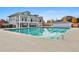 A large rectangular pool with a building in the background creates a resort-style experience at 140 Silvermere, Fayetteville, GA 30215