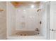 Elegant bathroom features a luxurious soaking tub with gold fixtures and marble-look surround at 1806 Wynthrop Manor Sw Dr, Marietta, GA 30064