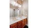 Bathroom with double vanity, large mirror, decorative light fixture, and neutral walls at 1806 Wynthrop Manor Sw Dr, Marietta, GA 30064