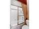 Bathroom tub and shower with glass door, white tile, and a curtain at 1806 Wynthrop Manor Sw Dr, Marietta, GA 30064