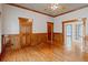 Dining Room with hardwood floors, wooden trim, paneled walls, and ample natural light from large windows at 1806 Wynthrop Manor Sw Dr, Marietta, GA 30064