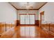 Dining room with detailed wood trim, hardwood floors, and a large window providing natural light at 1806 Wynthrop Manor Sw Dr, Marietta, GA 30064
