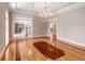 Elegant dining room features hardwood floors, a decorative chandelier, and decorative trim at 1806 Wynthrop Manor Sw Dr, Marietta, GA 30064