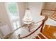 Two story foyer featuring elegant chandelier, high ceilings, and wooden staircase at 1806 Wynthrop Manor Sw Dr, Marietta, GA 30064