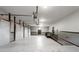 Expansive garage with multiple overhead doors and ample space for vehicles at 1806 Wynthrop Manor Sw Dr, Marietta, GA 30064