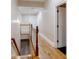 Upstairs hallway featuring hardwood floors, white railings, and doors at 1806 Wynthrop Manor Sw Dr, Marietta, GA 30064