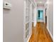 Hallway featuring hardwood floors and large windows with natural light spilling in at 1806 Wynthrop Manor Sw Dr, Marietta, GA 30064