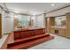 Large in-home hot tub with wood trim and a custom mural at 1806 Wynthrop Manor Sw Dr, Marietta, GA 30064