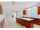 Spacious kitchen features a large island with cooktop, stainless steel appliances, and bright, sunlit windows at 1806 Wynthrop Manor Sw Dr, Marietta, GA 30064